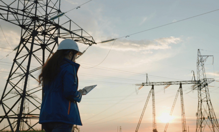 woman engineering examining power lines