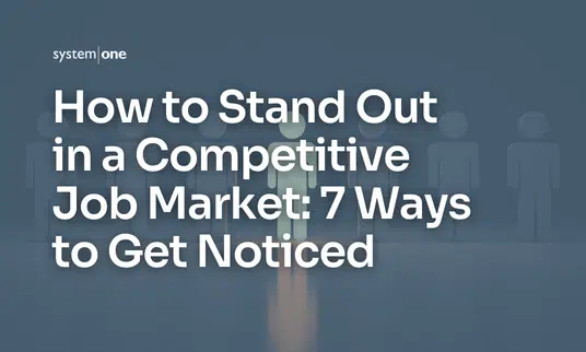 Stick figures in a line with the middle one highlighted in a bright color to show them standing our amongst the others